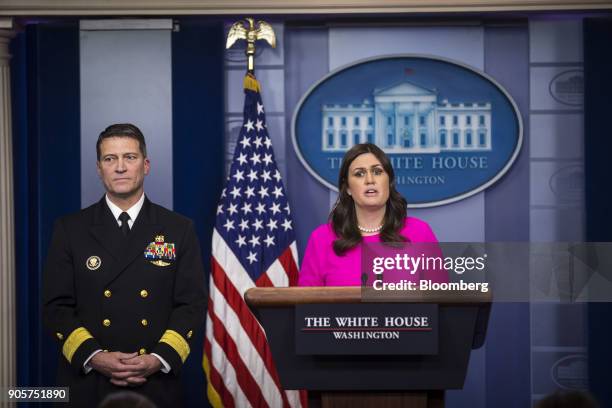 Sarah Huckabee Sanders, White House press secretary, speaks to members of the media while Ronny Jackson, physician for U.S. President Donald Trump,...