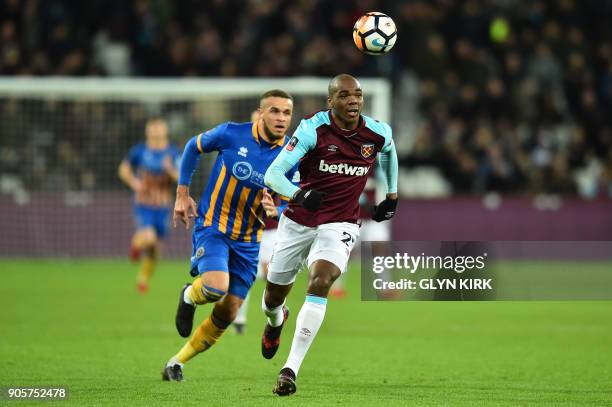 Shrewsbury Town's English striker Carlton Morris vies with West Ham United's Italian defender Angelo Ogbonna during the FA Cup third round replay...