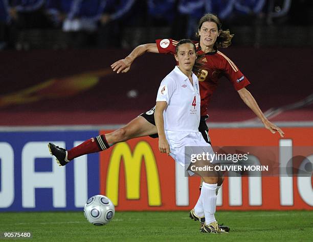 Germany's Kerstin Garefrekes struggles for the ball with England's Fara Williams during the final of the Women's EURO 2009 Germany vs England, on...