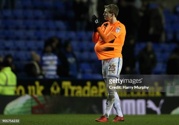 Jon Dadi Bodvarsson of Reading applauds fans with his hat-trick ball under his shirt after the Emirates FA Cup Third Round Replay match between...