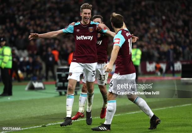 Reece Burke of West Ham United celebrates as he scores their first goal with team mates during The Emirates FA Cup Third Round Replay match between...