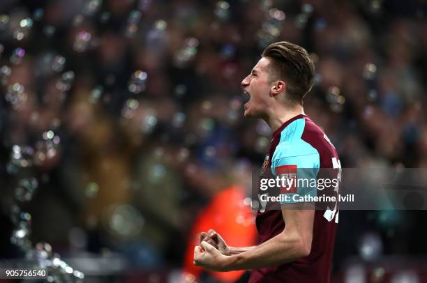 Reece Burke of West Ham United celebrates as he scores their first goal during The Emirates FA Cup Third Round Replay match between West Ham United...