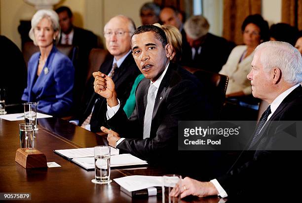President Barack Obama speaks as Health and Human Services Secretary Kathleen Sebelius , Interior Secretary Ken Salazar , Secretary of Defense Robert...