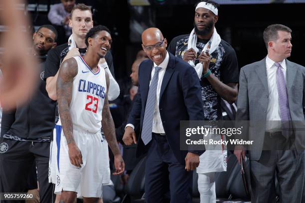 Lou Williams and assistant coach Sam Cassell of the Los Angeles Clippers smile during the game against the Sacramento Kings on January 11, 2018 at...