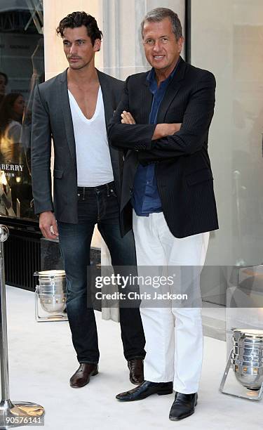 Photographer Mario Testino and model David Gandy attend Vogue and Burberry's cocktail reception as part of 'Fashion's Night Out' on September 10,...
