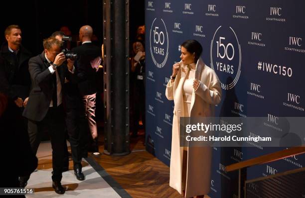 Adriana Lima visits the IWC booth during the Maison's launch of its Jubilee Collection at the Salon International de la Haute Horlogerie on January...