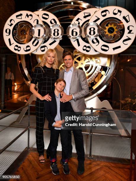 Karolina Kurkova, Archie Drury and son Tobin Jack Drury visit the IWC booth during the Maison's launch of its Jubilee Collection at the Salon...
