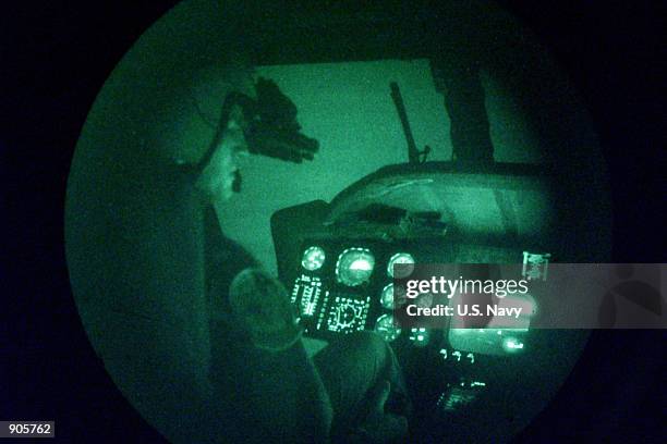 Lieutenant Junior Grade William Urban from Jacksonville, FL uses a Forward Looking Infrared system to search "survivors" during a combat search and...