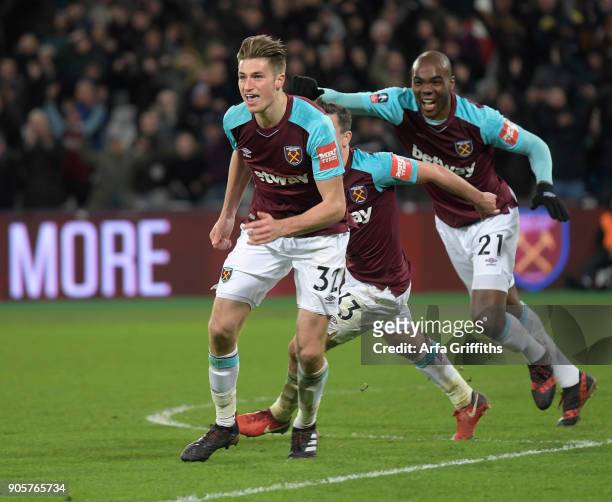 Reece Burke of West Ham United celebrates scoring the winning goal during The Emirates FA Cup Third Round Replay match between West Ham United and...