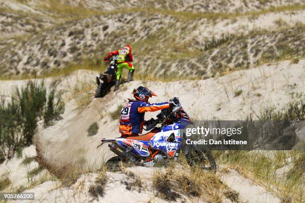 Gerry Van Der Byl of South Africa and BAS Dakar attempts to free his KTM bike from the sand in the Classe 2.2 : Marathon net to Oswaldo Burga of Peru...