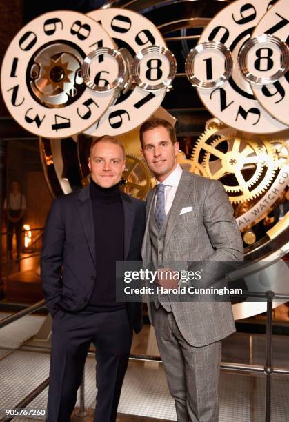 Valtteri Bottas and Christoph Grainger-Herr visit the IWC booth during the Maison's launch of its Jubilee Collection at the Salon International de la...