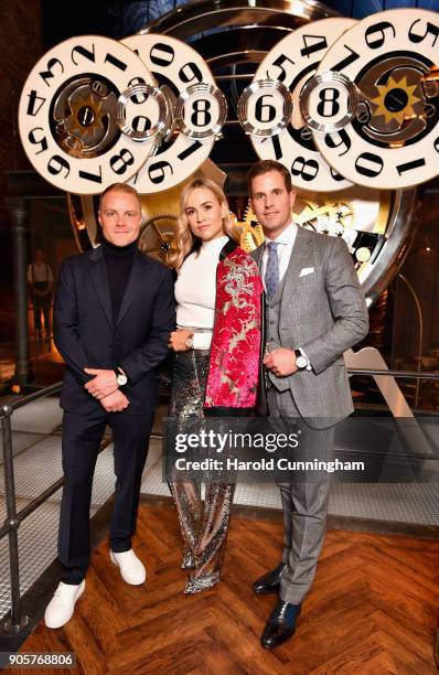 Valtteri Bottas, Carmen Jorda and Christoph Grainger-Herr visit the IWC booth during the Maison's launch of its Jubilee Collection at the Salon...