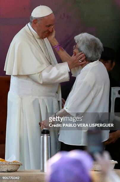 Pope Francis greets an elderly woman during his visit at Padre Hurtado Sanctuary in Santiago, on January 16, 2018. The pope landed in Santiago late...