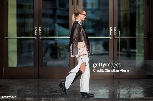 Celine Aagaard wearing Chloe bag, Celine sunglasses, brown leather jacket Dorothee Schumacher, dress Mardou & Dean, black H&M boots is seen during...