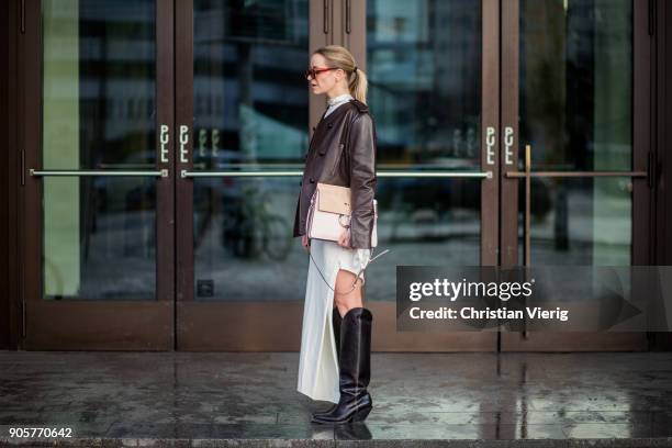 Celine Aagaard wearing Chloe bag, Celine sunglasses, brown leather jacket Dorothee Schumacher, dress Mardou & Dean, black H&M boots is seen during...