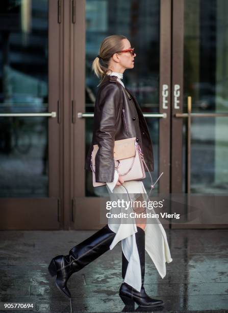 Celine Aagaard wearing Chloe bag, Celine sunglasses, brown leather jacket Dorothee Schumacher, dress Mardou & Dean, black H&M boots is seen during...