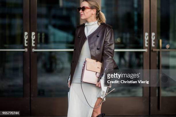 Celine Aagaard wearing Chloe bag, Celine sunglasses, brown leather jacket Dorothee Schumacher, dress Mardou & Dean, black H&M boots is seen during...