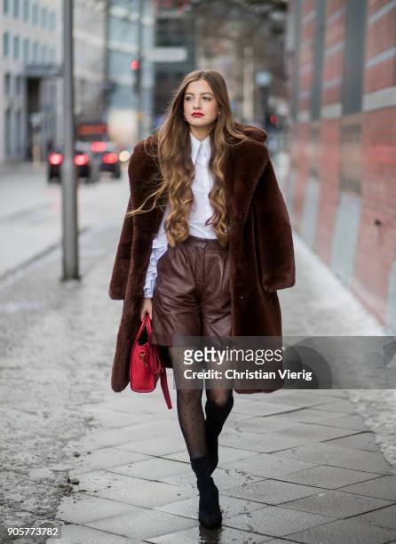 Zoe Pastelle wearing top Anne Fontaine, brown shors Boss, red Celine bag, brown Mango teddy coat, black ankle boots, sheer tights is seen during the...