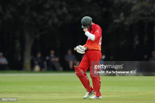 Liam Roche of Zimbabwe looks dejected after being dismissed by Jonathan Merlo of Australia during the ICC U19 Cricket World Cup match between...