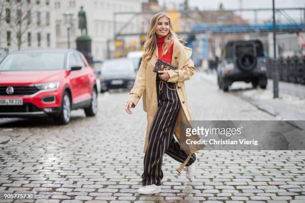 Xenia van der Woodsen wearing Louis Vuitton shoes, striped By Malene Birger pants, trench coat Topshop, Marc Cain top, Celine earrings, Louis Vuitton...