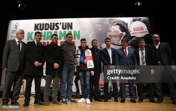 Fawzi al-Junaidi who was manhandled and detained by Israeli soldiers and became the symbol of Jerusalem resistance, poses for a photo with Mayor of...