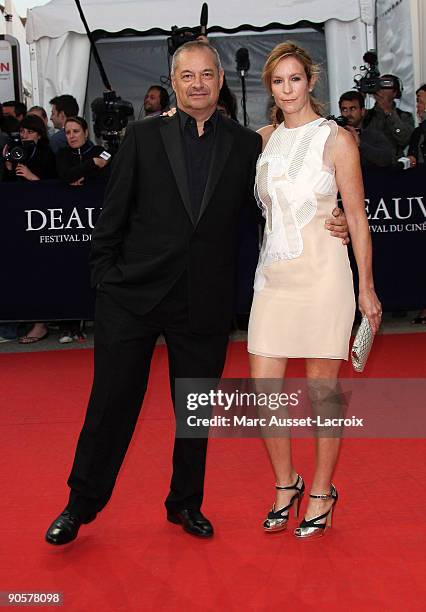 Jean-Pierre Jeunet and his wife pose before the screening of 'The private lifes of Pippa Lee ' directed by Rebecca Miller at the 35th US film...