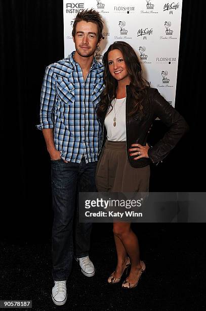 Robert Buckley poses for a picture next to Heather Mitchell as they attends the AXE Instinct Sponsored Duckie Brown Spring 2010 Fashion Show at...