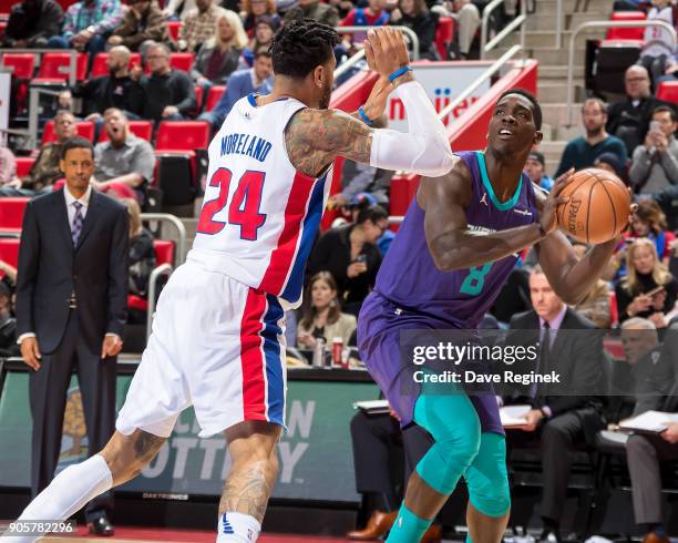 Eric Moreland of the Detroit Pistons defends against Johnny O'Bryant III of the Charlotte Hornets during the an NBA game at Little Caesars Arena on...