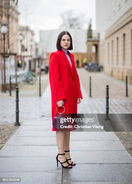 Maria Barteczko wearing long red cashmere coat Alexander McQueen, light pink turtleneck sweater Asos, big hoop earrings H&M, black high heels...