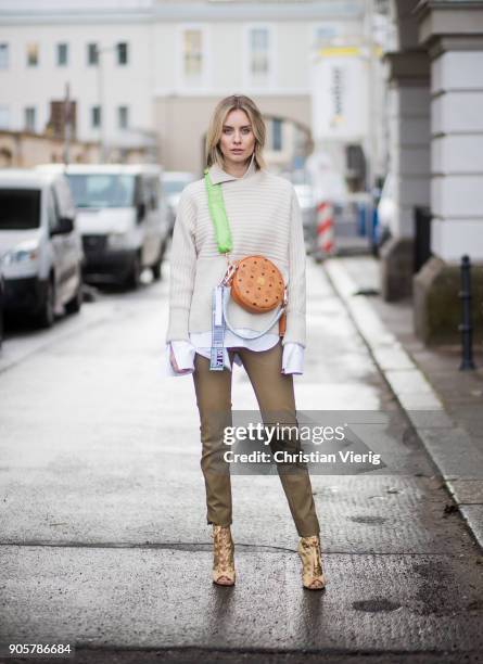 Lisa Hahnbueck wearing Gianvito Rossi high heels, MCM x Koenigsouvenir bag, knit, pants, button shirt with long sleeves Dorothee Schumacher is seen...