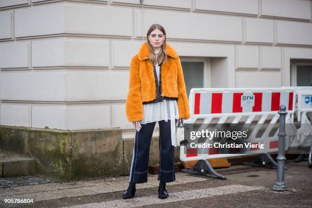 Swantje Soemmer wearing yellow H&M trend jacket, blouse and pants Sportmax, Longchamp bag, Zara ankle boots is seen outside Der Berliner Modesalon...