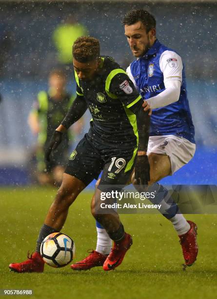 Reggie Lambe of Carlisle United holds off a challenge from Morgan Fox of Sheffield Wednesday during the Emirates FA Cup Third Round Replay match...