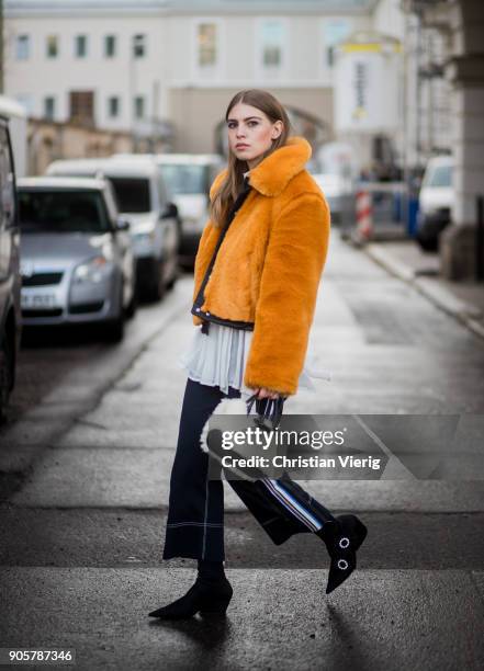 Swantje Soemmer wearing yellow H&M trend jacket, blouse and pants Sportmax, Longchamp bag, Zara ankle boots is seen outside Der Berliner Modesalon...