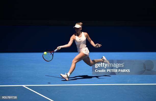 Ukraine's Marta Kostyuk hits a return against Australia's Olivia Rogowska during their women's singles second round match on day three of the...