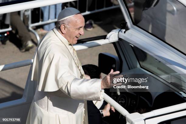 Pope Francis waves to attendees from a motorcade before mass at O'Higgins Park in Santiago, Chile, on Tuesday, Jan. 16, 2018. 400,000 Chileans...