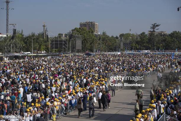 Attendees wait for Pope Francis, not pictured, to arrive for mass at O'Higgins Park in Santiago, Chile, on Tuesday, Jan. 16, 2018. 400,000 Chileans...