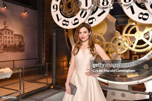 Anna Drijver visits the IWC booth during the Maison's launch of its Jubilee Collection at the Salon International de la Haute Horlogerie on January...