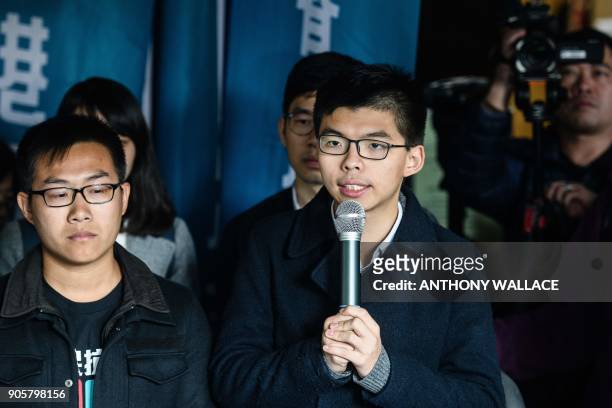 Pro-democracy activists Joshua Wong and Raphael Wong speak to the press before entering the High Court to hear their sentences on protest related...