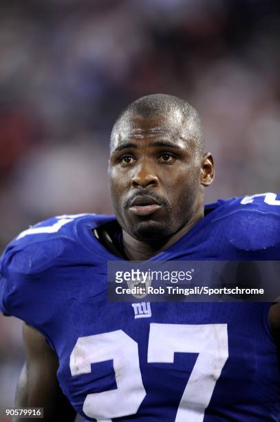 Brandon Jacobs of the New York Giants looks on against the New York Jets in a preseason game at Giants Stadium on August 29, 2009 in East Rutherford,...