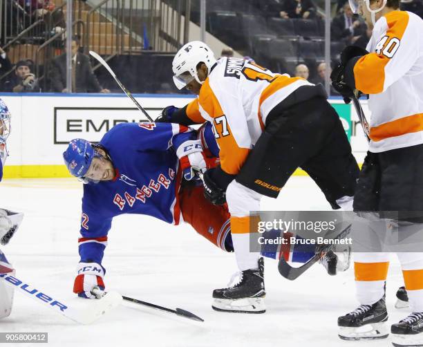 Wayne Simmonds of the Philadelphia Flyers checks Brendan Smith of the New York Rangers during the third period at Madison Square Garden on January...