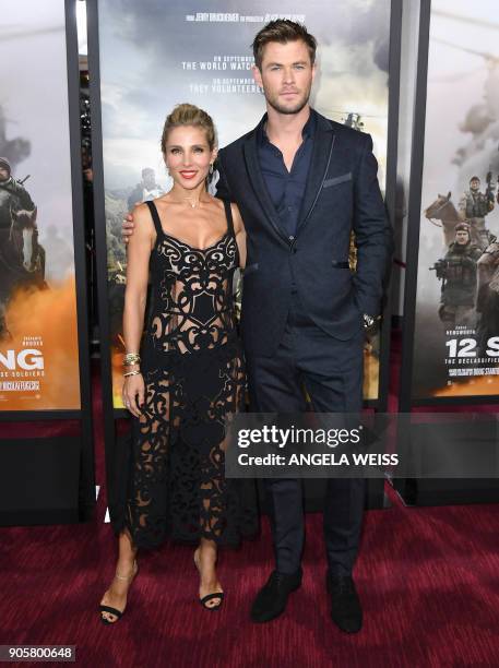 Actors Elsa Pataky and Chris Hemsworth attend the world premiere of "12 Strong" at Jazz at Lincoln Center on January 16 in New York City. / AFP PHOTO...