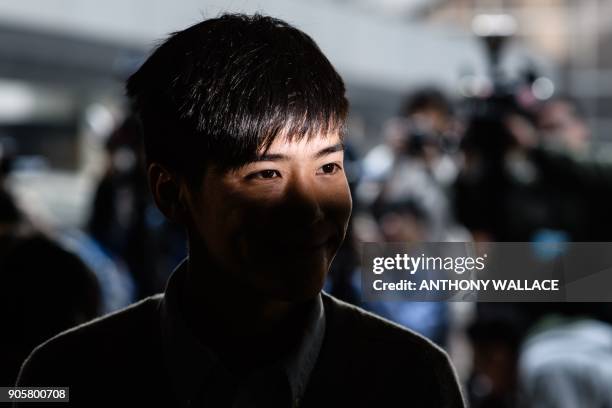 Pro-democracy activist Lester Shum enters the High Court to hear his sentence for protest related charges in Hong Kong on January 17, 2018. Hong Kong...