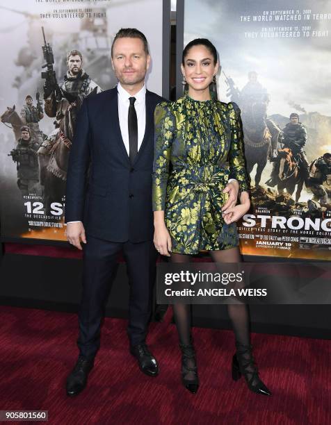 Director Nicolai Fuglsig and guest attend the world premiere of "12 Strong" at Jazz at Lincoln Center on January 16 in New York City. / AFP PHOTO /...