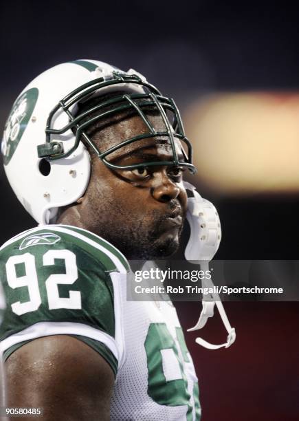 Shaun Ellis of the New York Jets looks on against the New York Giants in a preseason game at Giants Stadium on August 29, 2009 in East Rutherford,...
