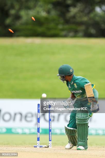 Kenan Smith of South Africa is bowled out during the ICC U19 Cricket World Cup match between the West Indies and South Africa at Bay Oval on January...