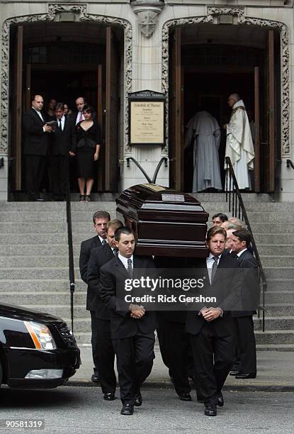 Pall bearers carry the casket of writer Dominick Dunne after his funeral at The Church of St. Vincent Ferrer on September 10, 2009 in New York City....