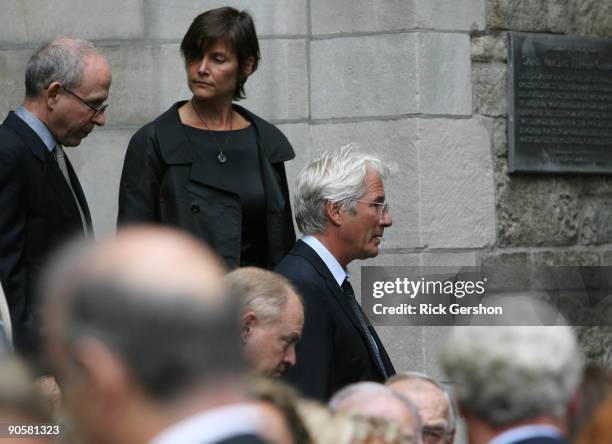 Actor Richard Gere , his wife Carey Lowell and actor Bob Balaban exit the funeral of writer Dominick Dunne at The Church of St. Vincent Ferrer on...