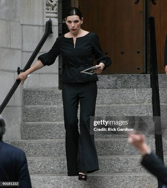 Actress Julianna Margulies exits the funeral of writer Dominick Dunne at The Church of St. Vincent Ferrer on September 10, 2009 in New York City....