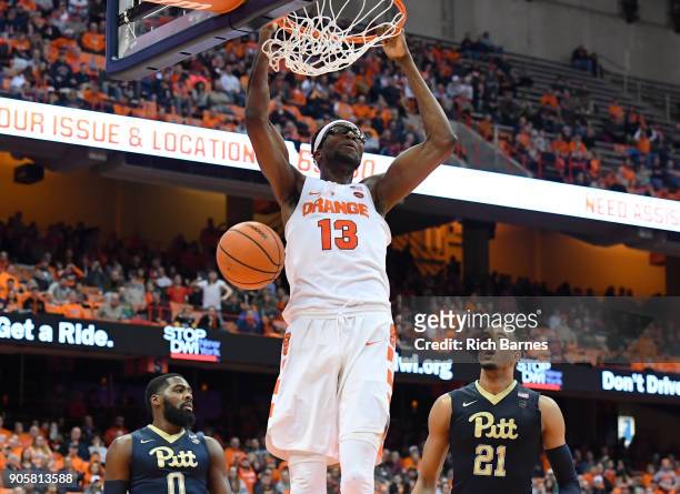 Paschal Chukwu of the Syracuse Orange dunks the ball between Jared Wilson-Frame and Terrell Brown of the Pittsburgh Panthers during the first half at...