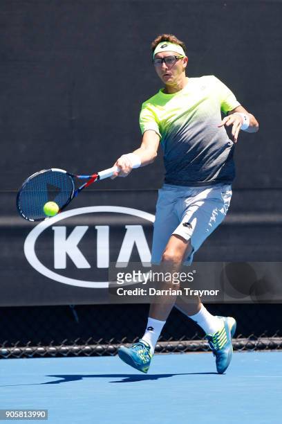 Denis Istomin of Uzbekistan plays a forehand in his second round match against Kyle Edmund of Great Britain on day three of the 2018 Australian Open...